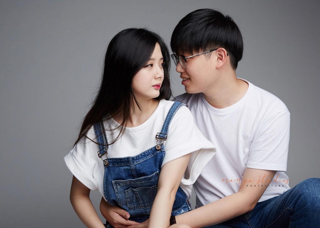 natural and fun couple portraits with in singapore studio