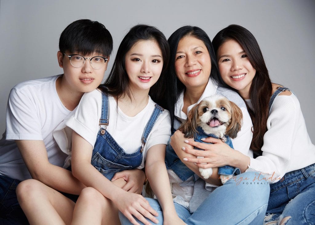 natural and fun family portraits with pet dog in singapore studio