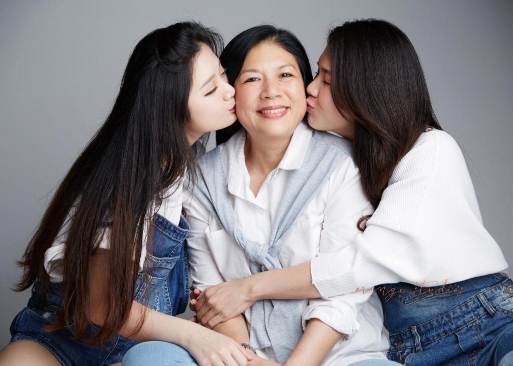 natural and fun mum and daughters family portraits in singapore studio