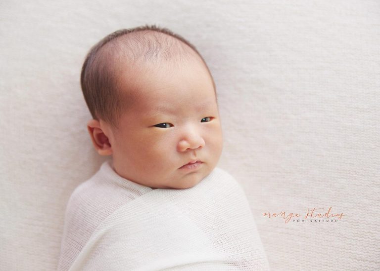 8 days old awake baby boy natural newborn portraits in singapore studio