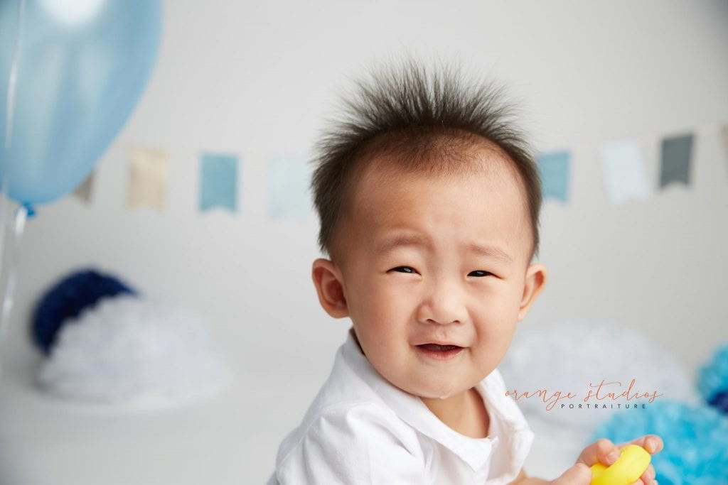 one year old baby boy cake smash portraits in singapore studio