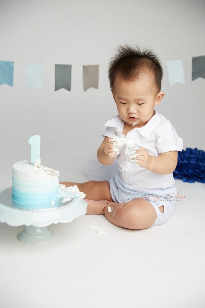 one year old baby boy cake smash portraits in singapore studio