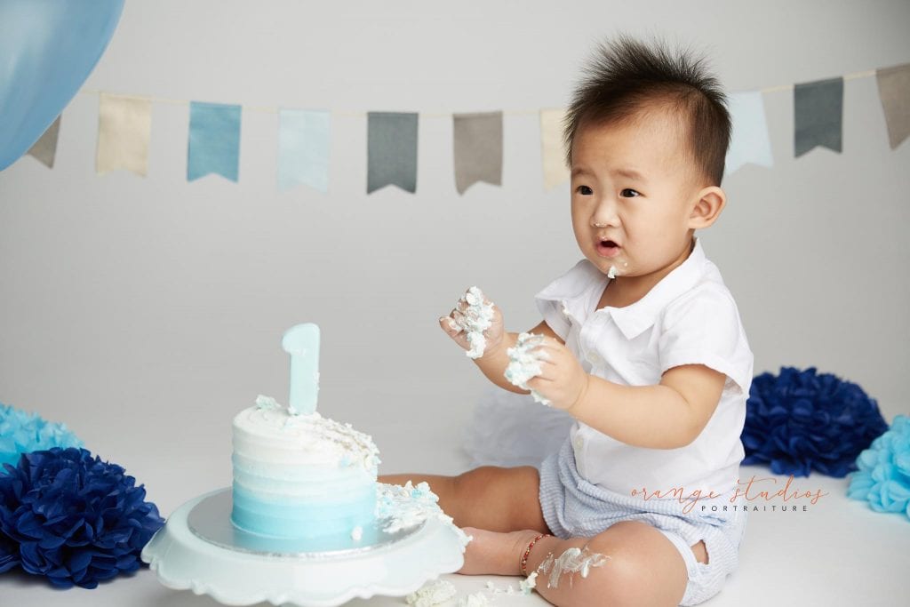 one year old baby boy cake smash portraits in singapore studio