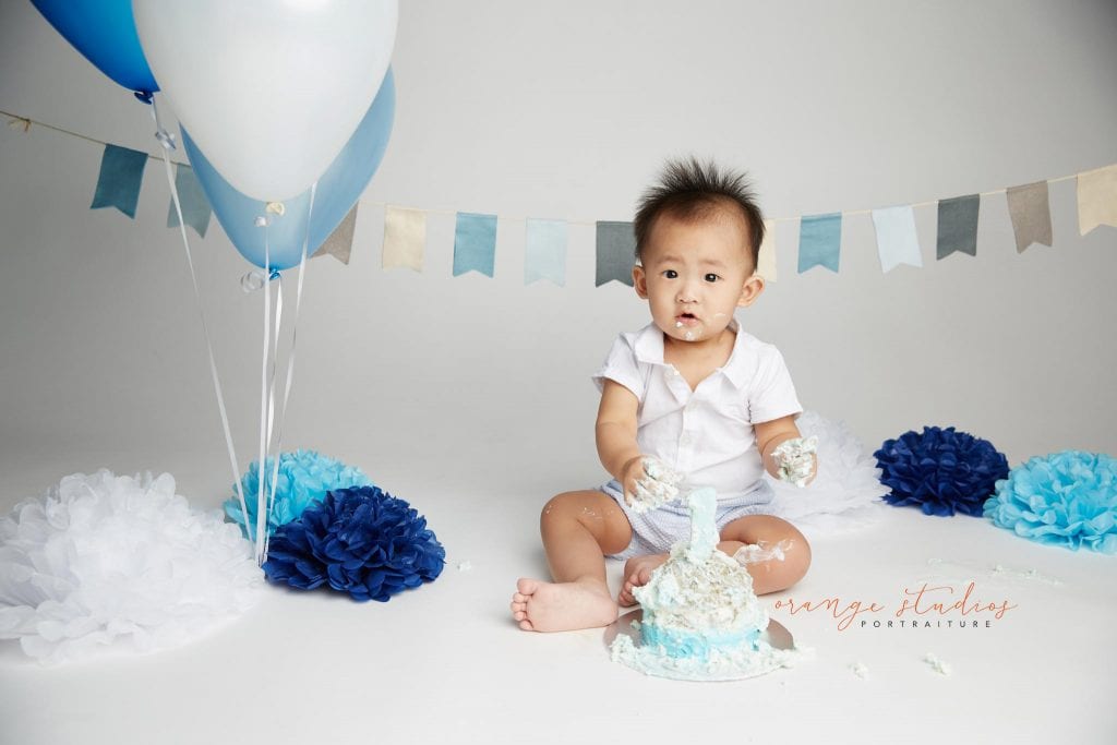 one year old baby boy cake smash portraits in singapore studio