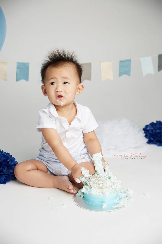 one year old baby boy cake smash portraits in singapore studio
