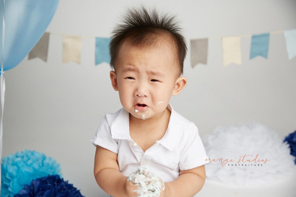 one year old baby boy cake smash portraits in singapore studio