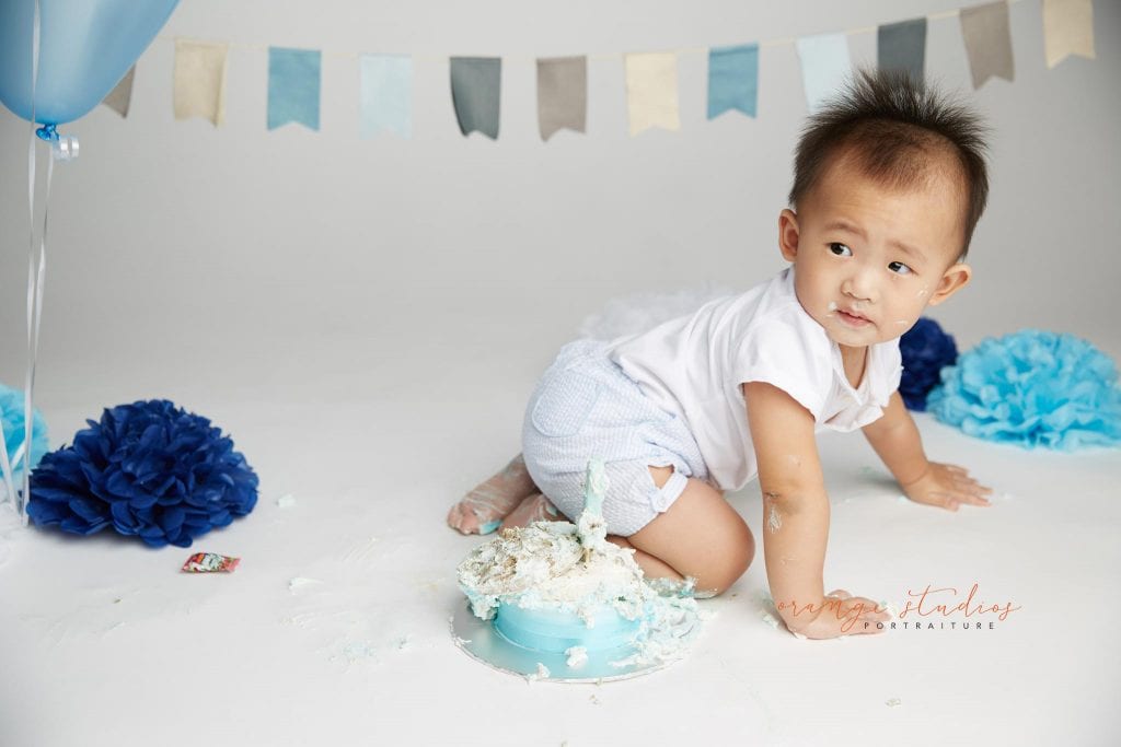 one year old baby boy cake smash portraits in singapore studio