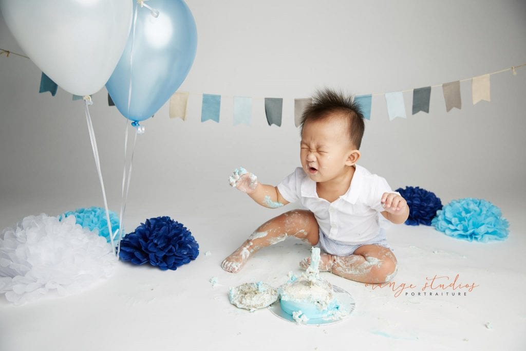 one year old baby boy cake smash portraits in singapore studio