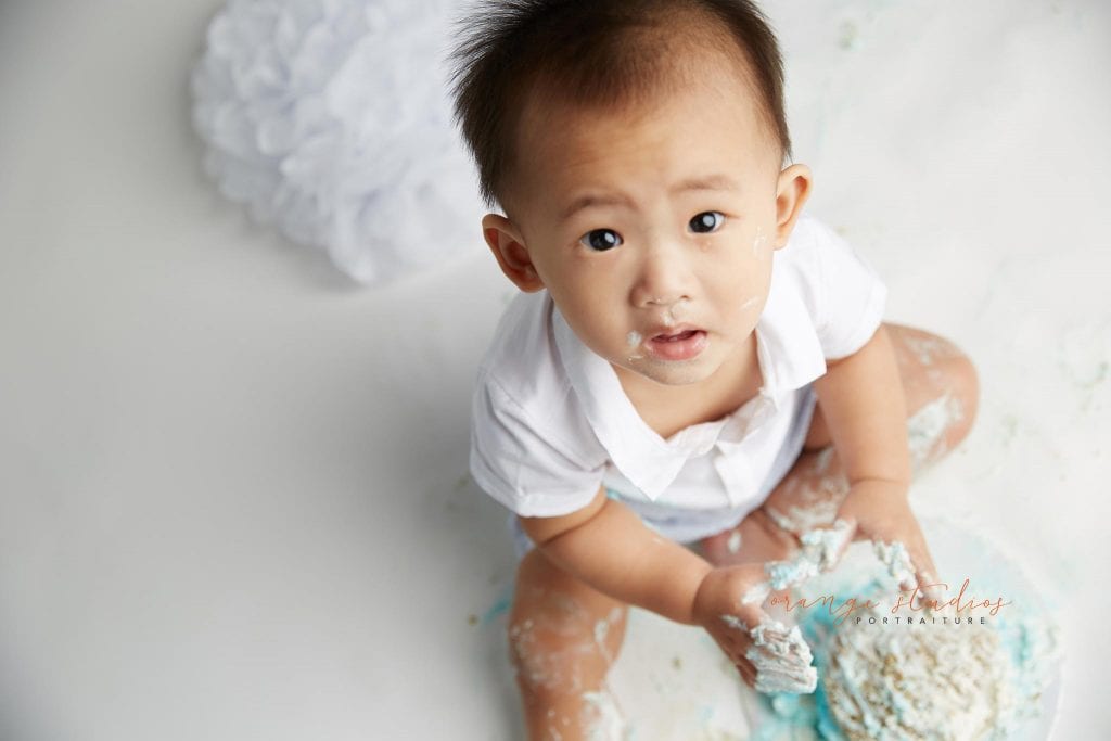 one year old baby boy cake smash portraits in singapore studio