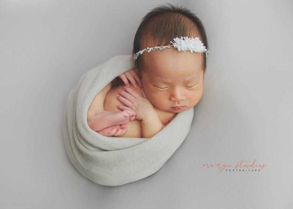 7 days old baby girl simple and clean newborn portraits in singapore studio