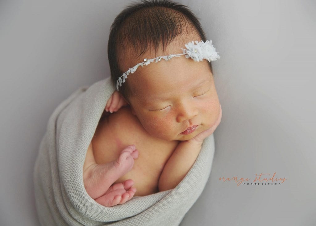 7 days old baby girl simple and clean newborn portraits in singapore studio