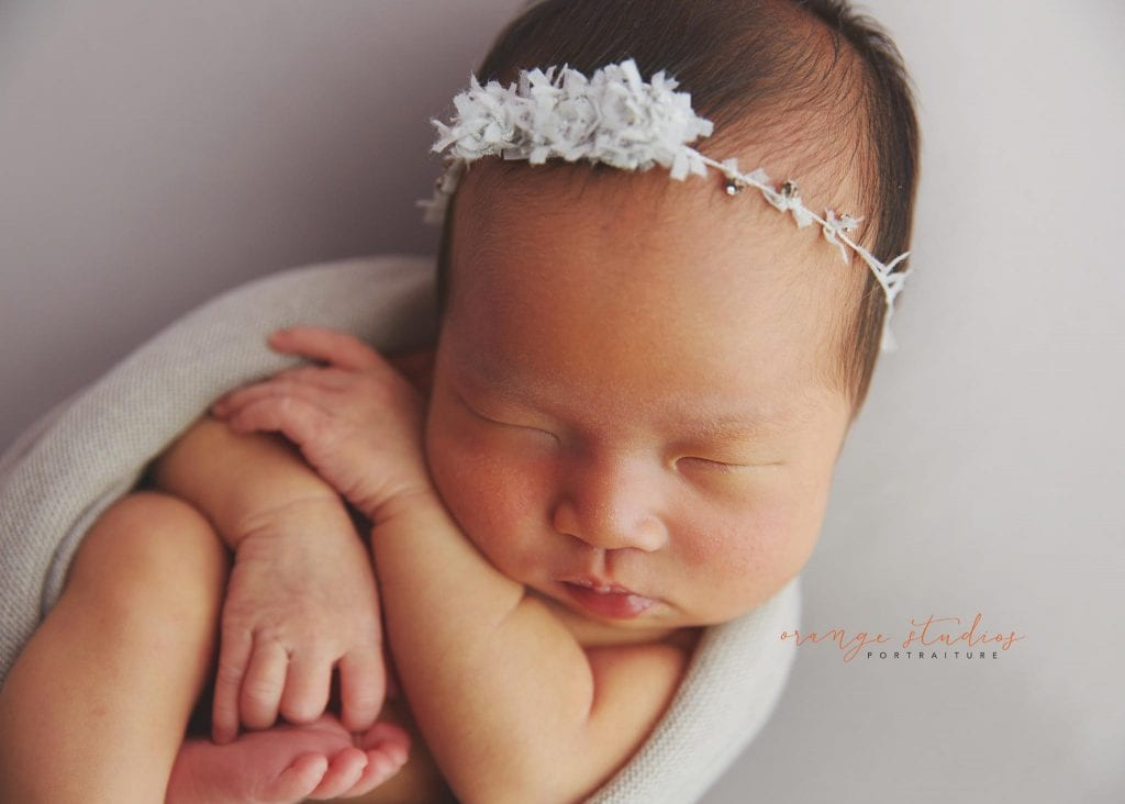 7 days old baby girl simple and clean newborn portraits in singapore studio
