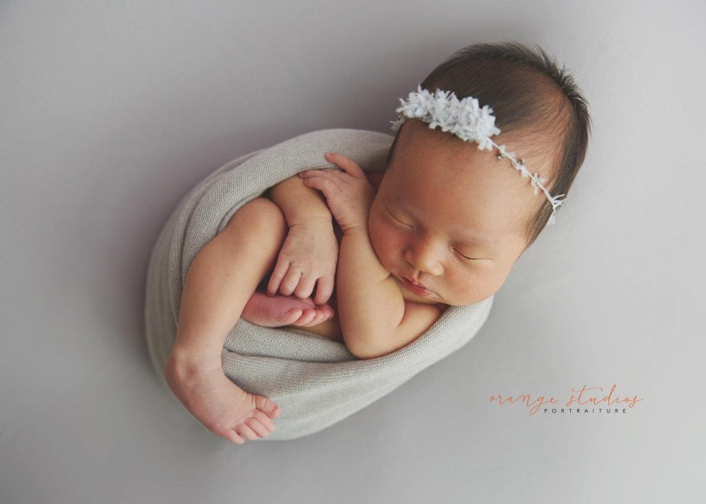 7 days old baby girl simple and clean newborn portraits in singapore studio