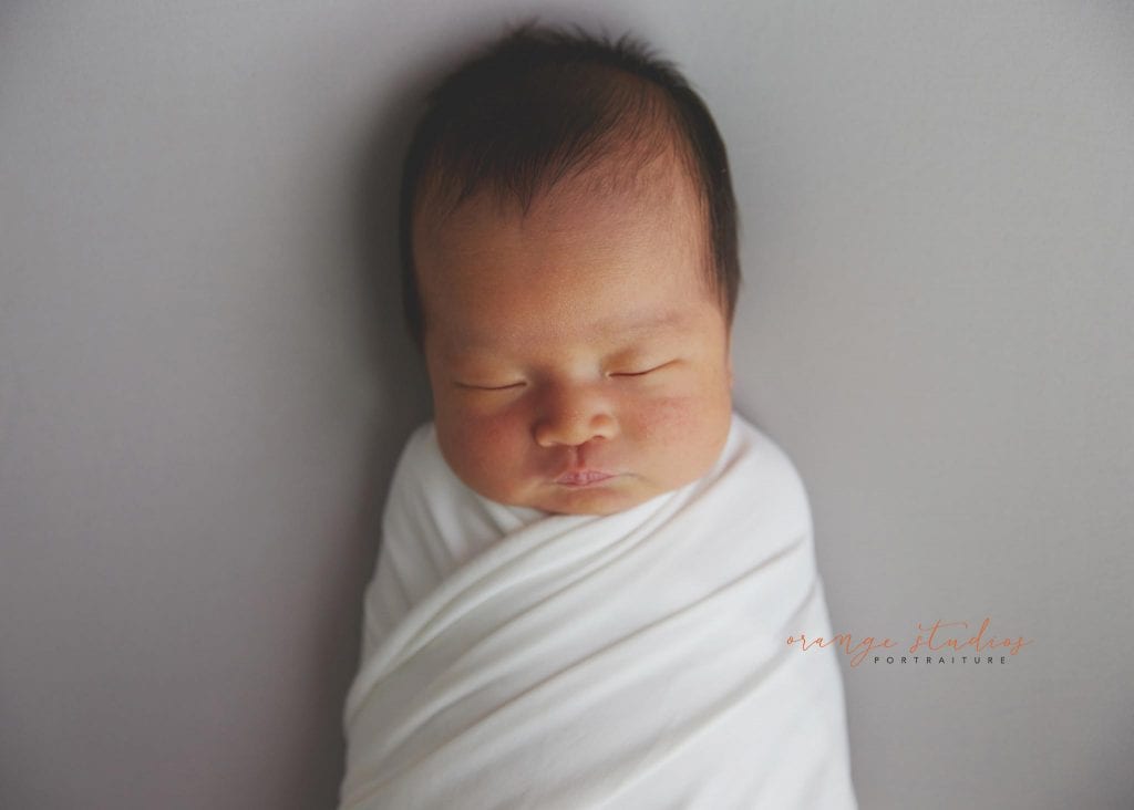 7 days old baby girl simple and clean newborn portraits in singapore studio