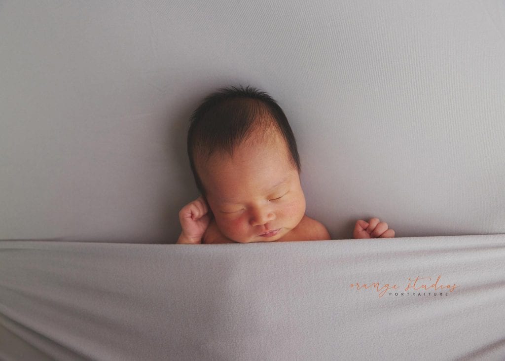 7 days old baby girl simple and clean newborn portraits in singapore studio