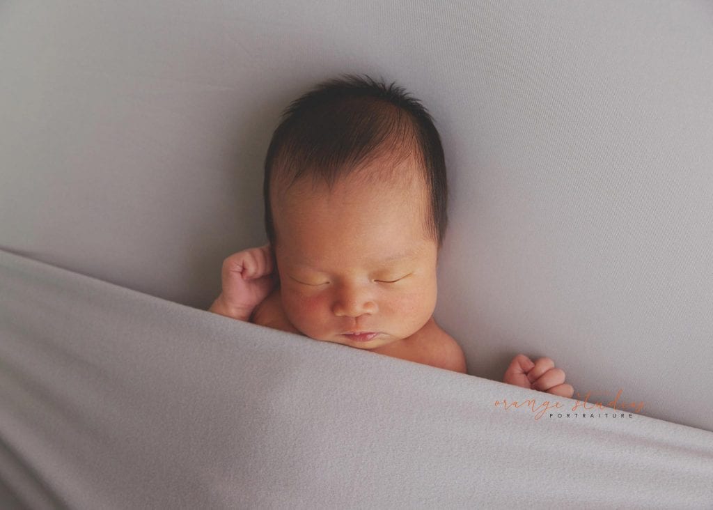 7 days old baby girl simple and clean newborn portraits in singapore studio