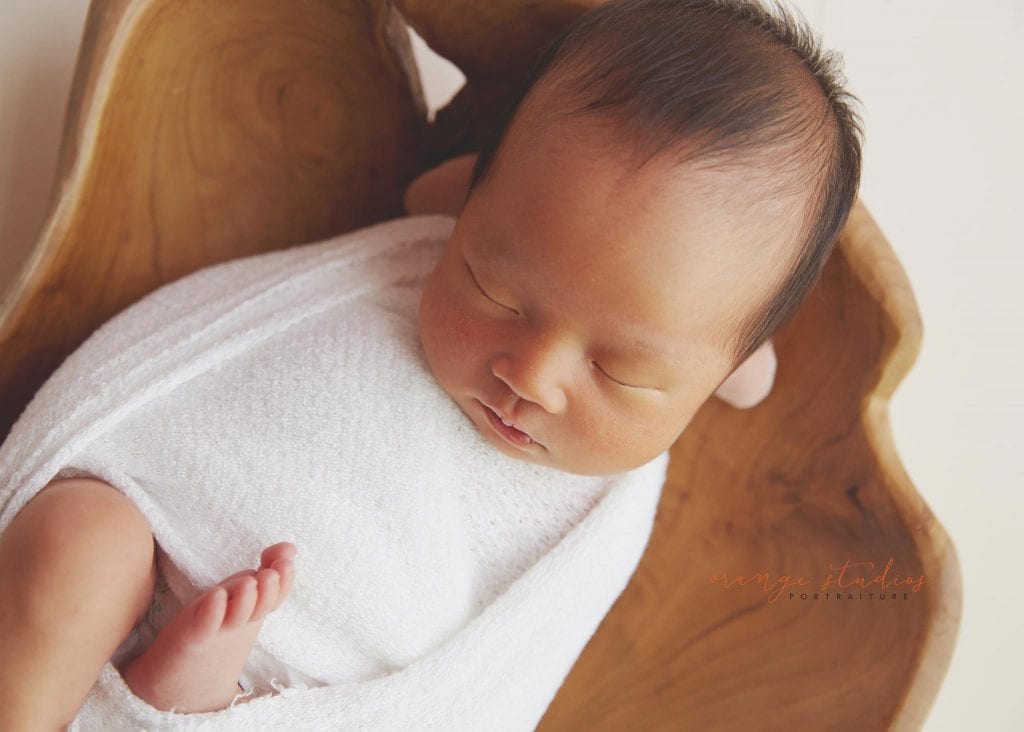 7 days old baby girl newborn portraits in prop in singapore studio