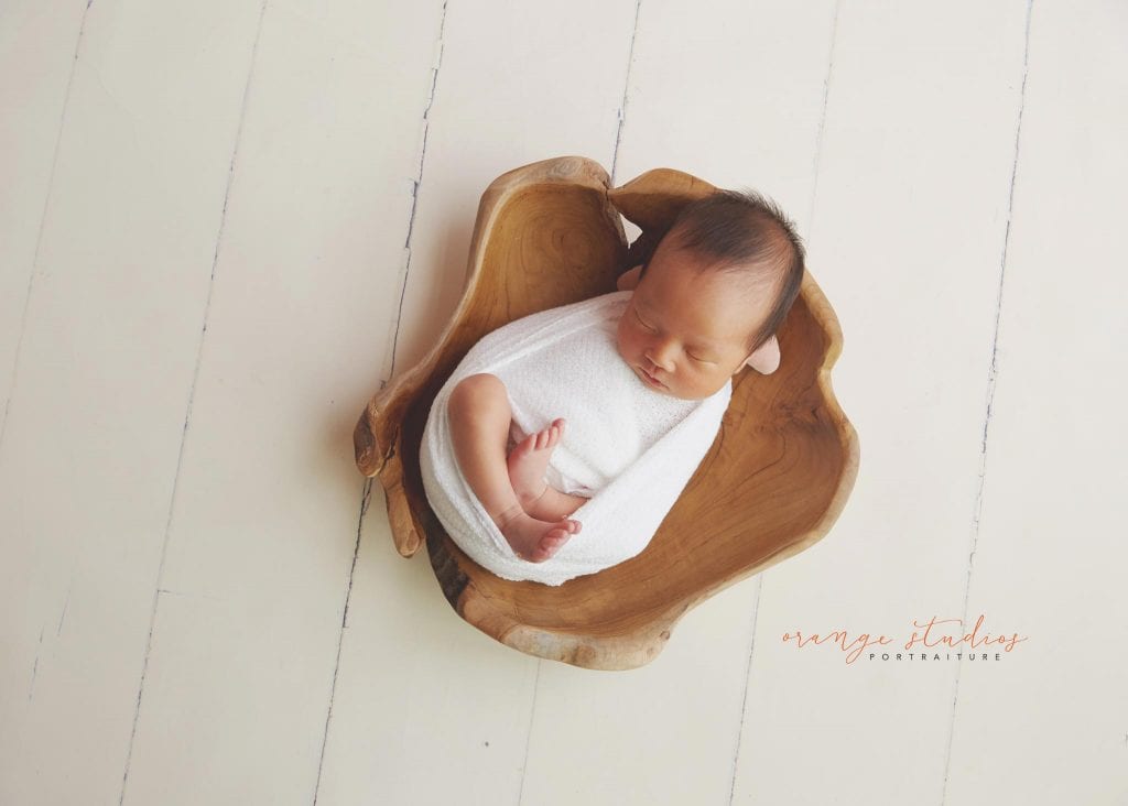 7 days old baby girl newborn portraits in prop in singapore studio
