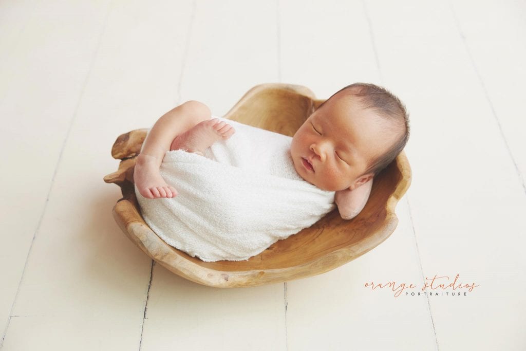 7 days old baby girl newborn portraits in prop in singapore studio