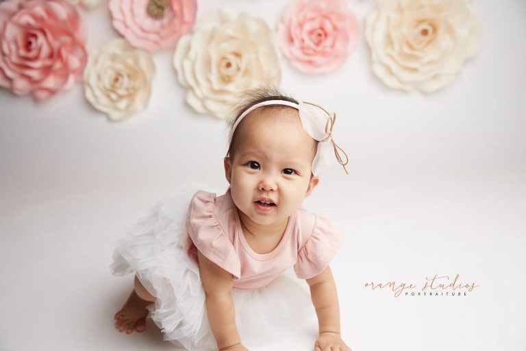 one year old baby girl flower wall portraits in singapore studio