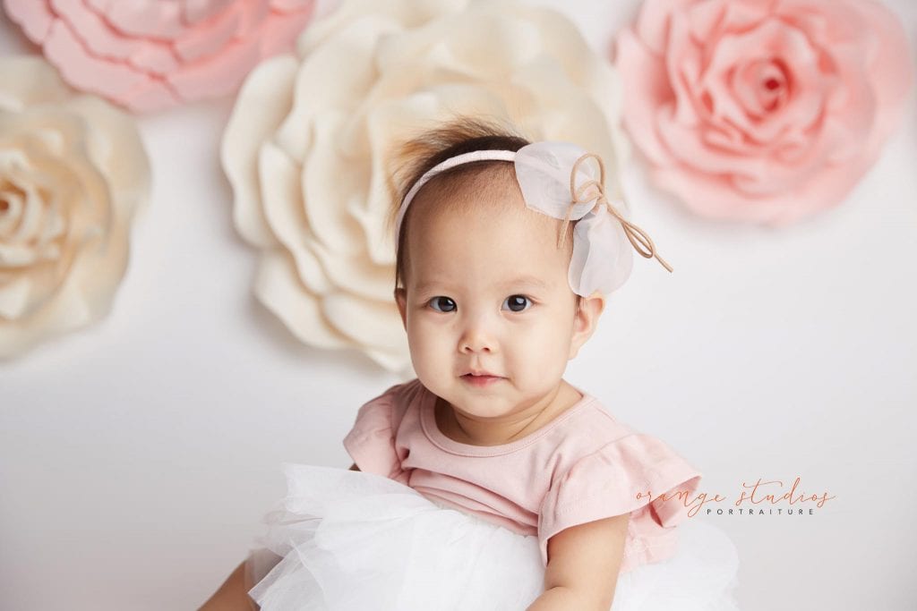 one year old baby girl flower wall portraits in singapore studio