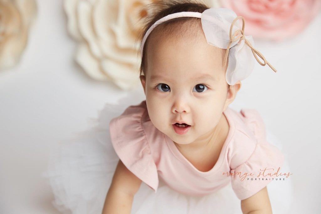 one year old baby girl flower wall portraits in singapore studio