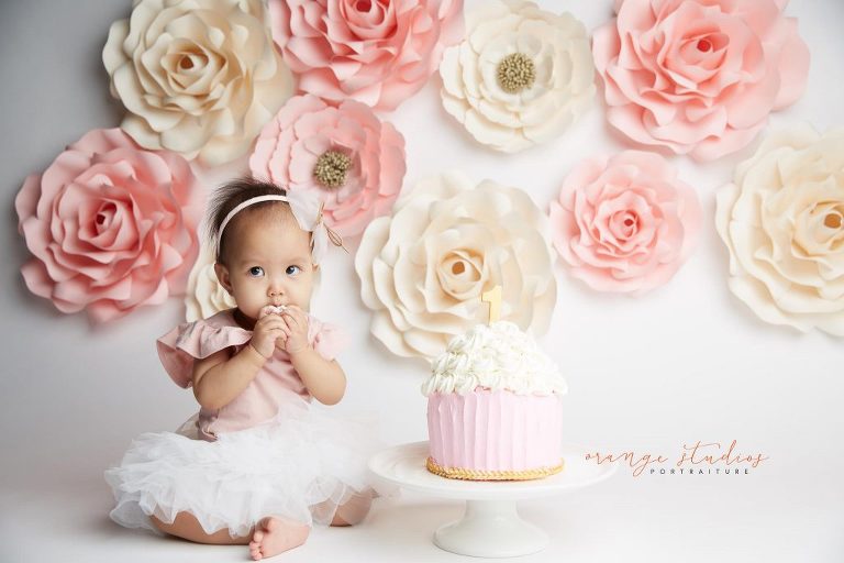 one year old baby girl flower wall cake smash portraits in singapore studio