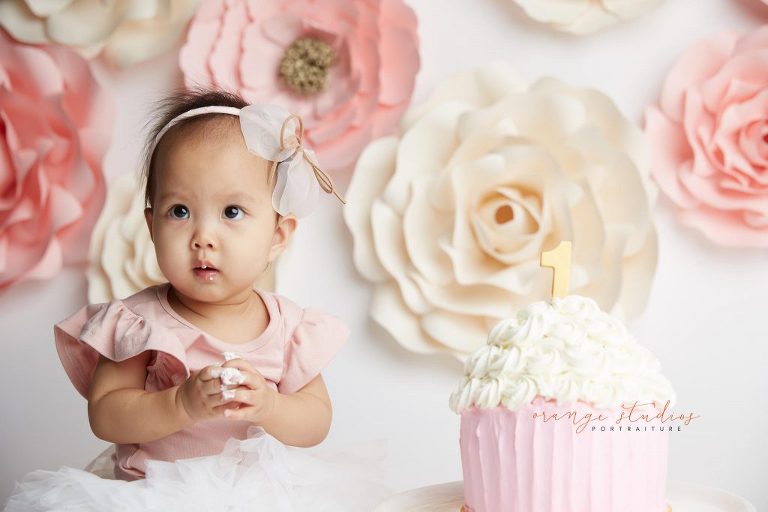 one year old baby girl flower wall cake smash portraits in singapore studio