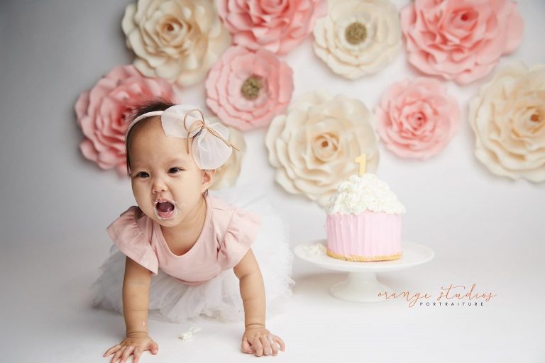one year old baby girl flower wall cake smash portraits in singapore studio