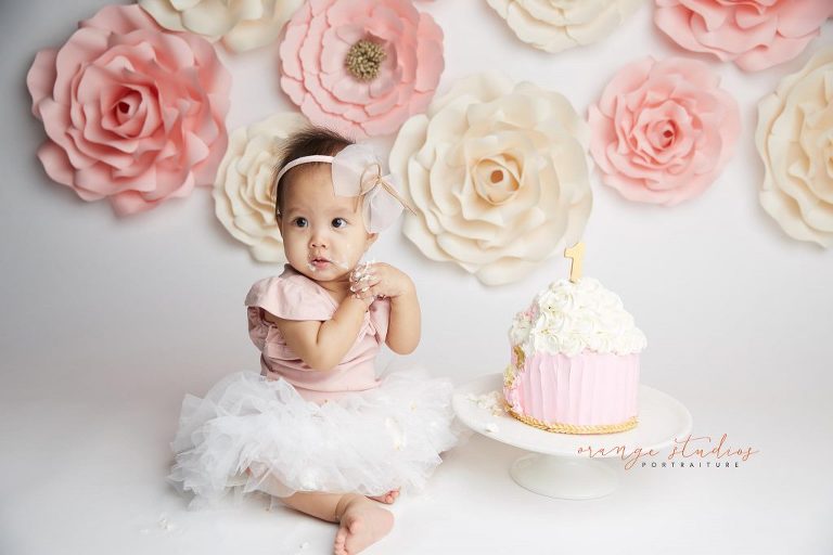 one year old baby girl flower wall cake smash portraits in singapore studio