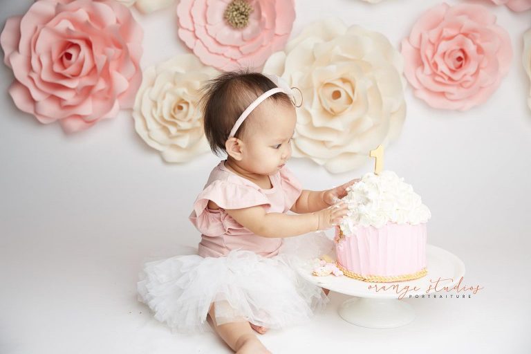 one year old baby girl flower wall cake smash portraits in singapore studio