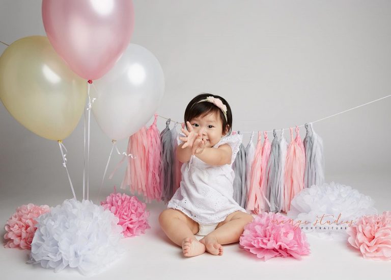 one year old baby girl cake smash portraits in singapore studio