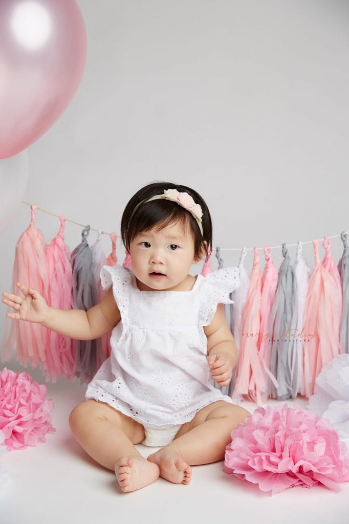 one year old baby girl cake smash portraits in singapore studio
