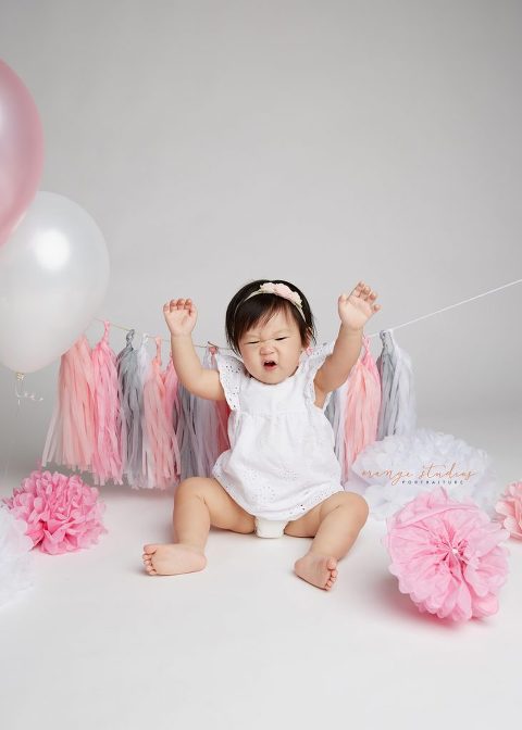 one year old baby girl cake smash portraits in singapore studio