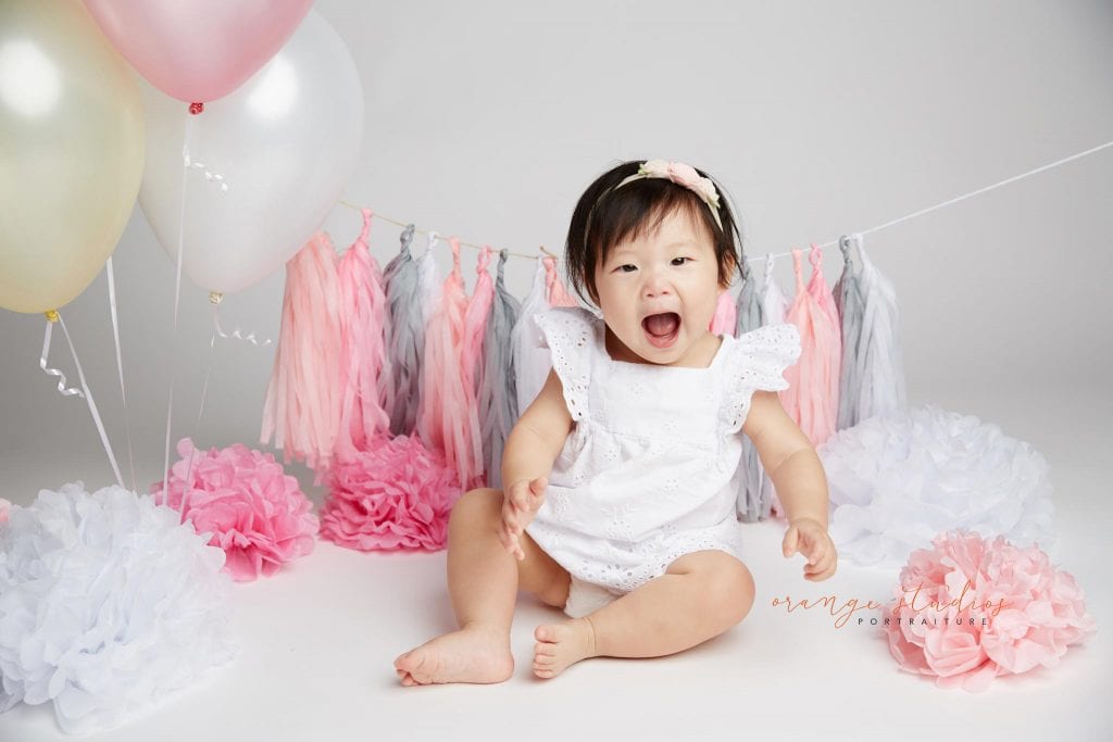 one year old baby girl cake smash portraits in singapore studio