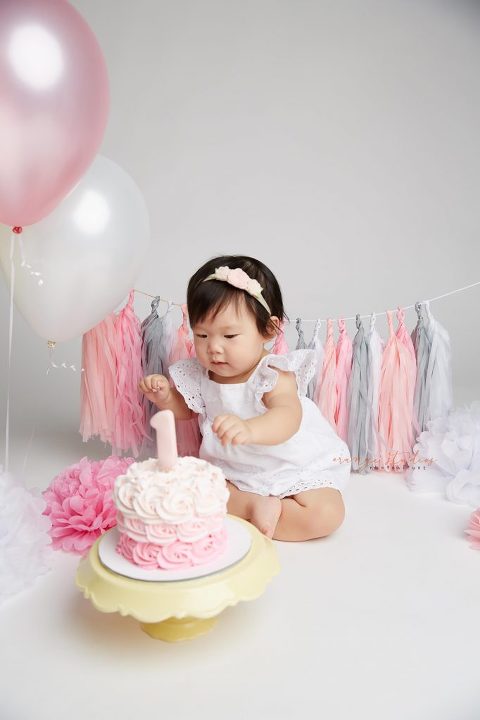 one year old baby girl cake smash portraits in singapore studio