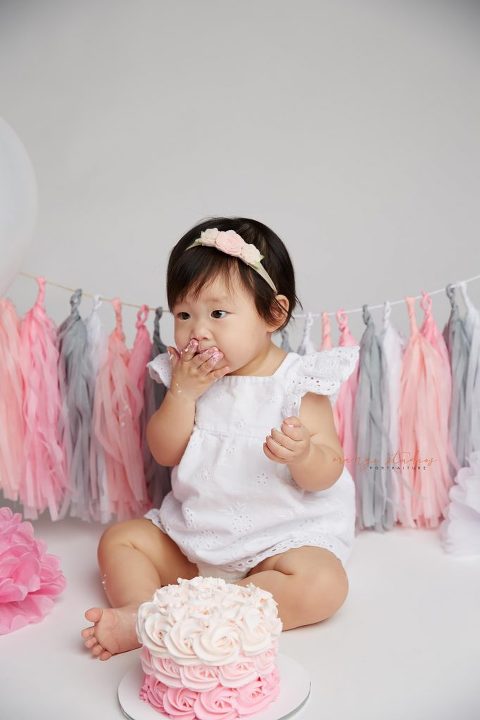 one year old baby girl cake smash portraits in singapore studio