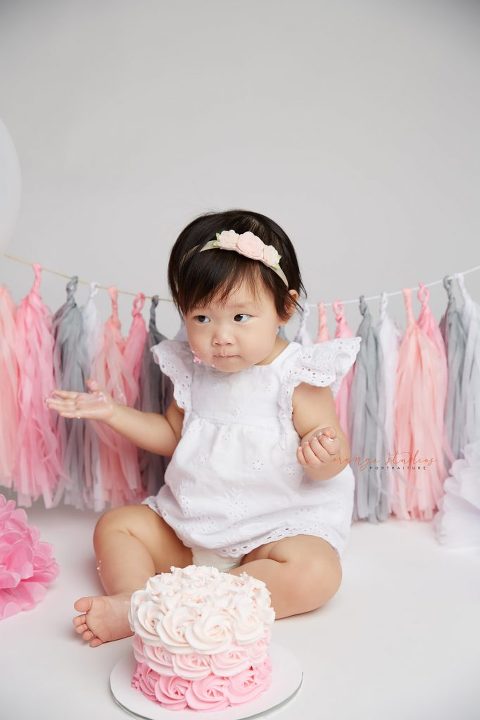 one year old baby girl cake smash portraits in singapore studio