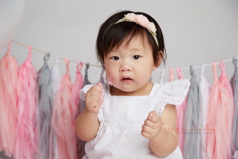 one year old baby girl cake smash portraits in singapore studio