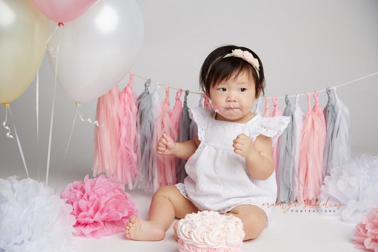 one year old baby girl cake smash portraits in singapore studio