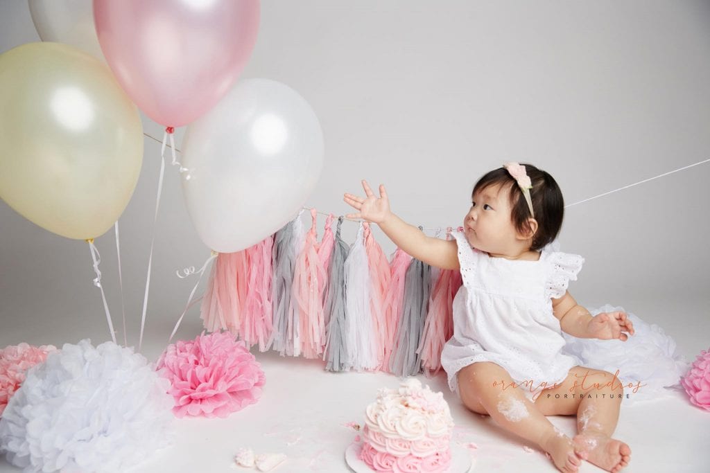 one year old baby girl cake smash portraits in singapore studio