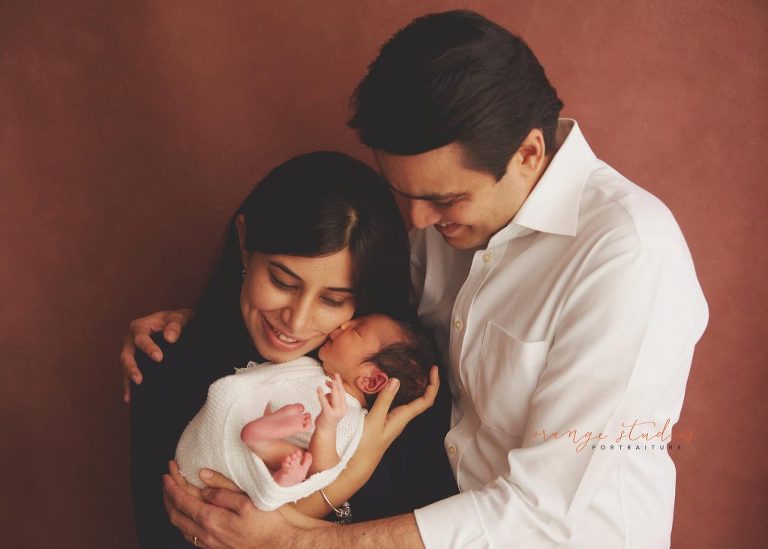 10 days old baby boy newborn portraits with parents in singapore studio