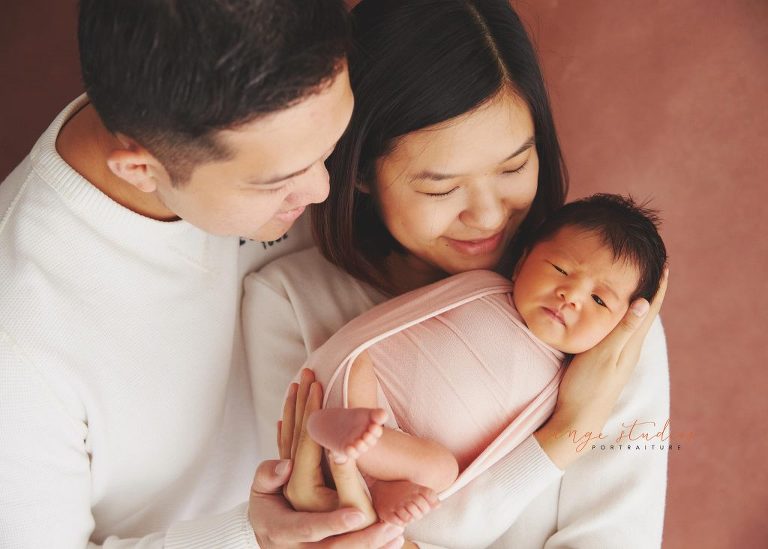9 days old baby girl newborn portraits with parents in singapore studio