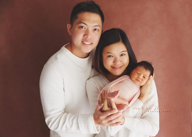 9 days old baby girl newborn portraits with parents in singapore studio