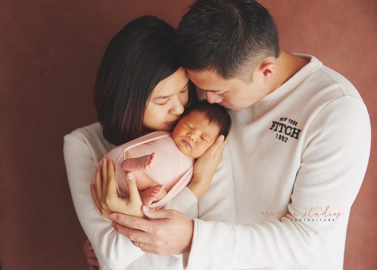 9 days old baby girl newborn portraits with parents in singapore studio