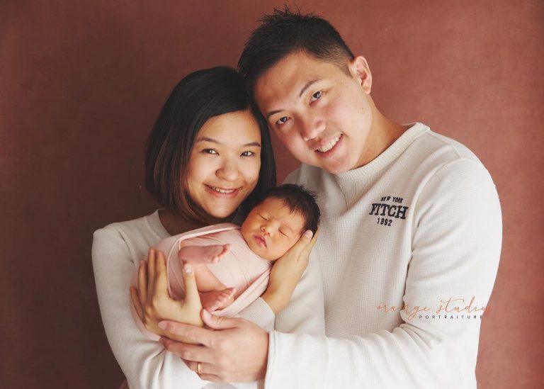 9 days old baby girl newborn portraits with parents in singapore studio