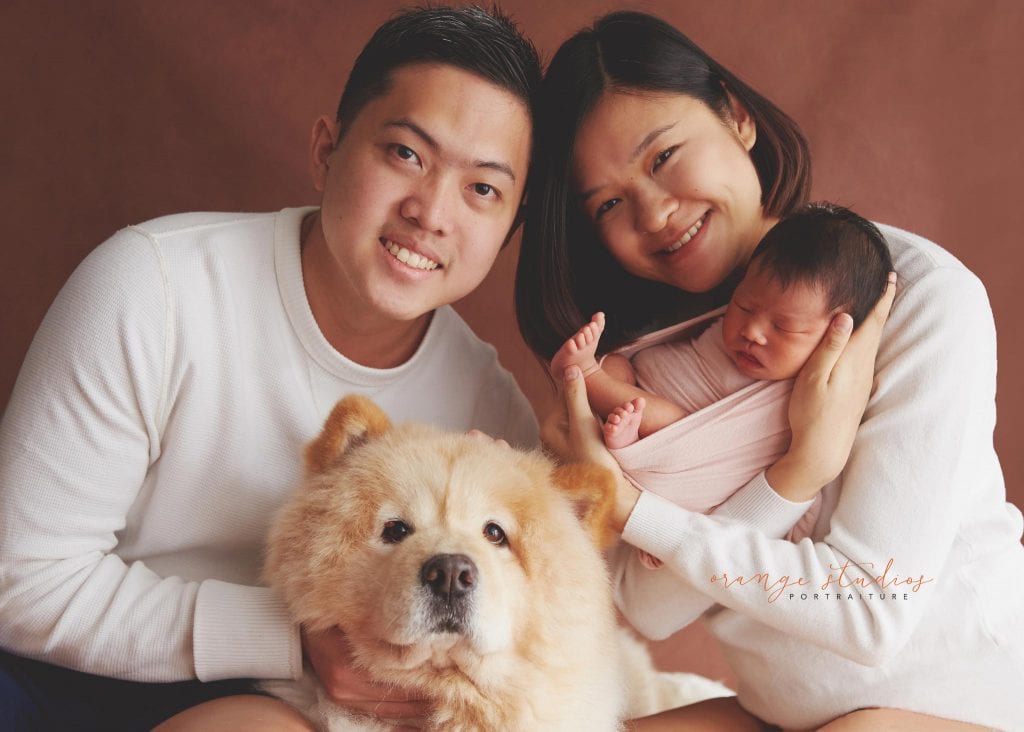 9 days old baby girl newborn portraits with parents and dog in singapore studio