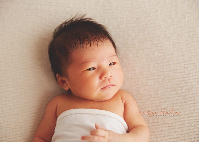 9 days old baby girl natural and clean newborn portraits in singapore studio