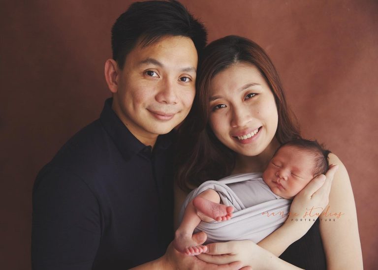 7 days old baby boy newborn portraits with parents in singapore home