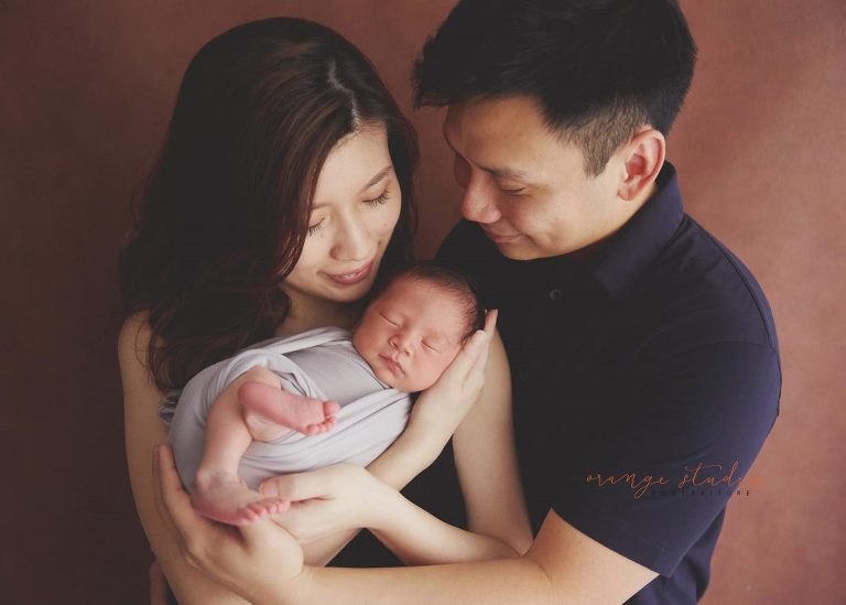 7 days old baby boy newborn portraits with parents in singapore home